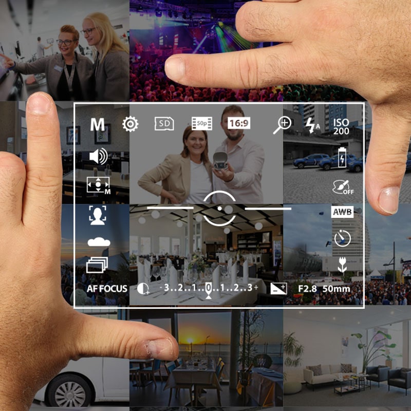 Zwei Hände zeigen eine Kamera